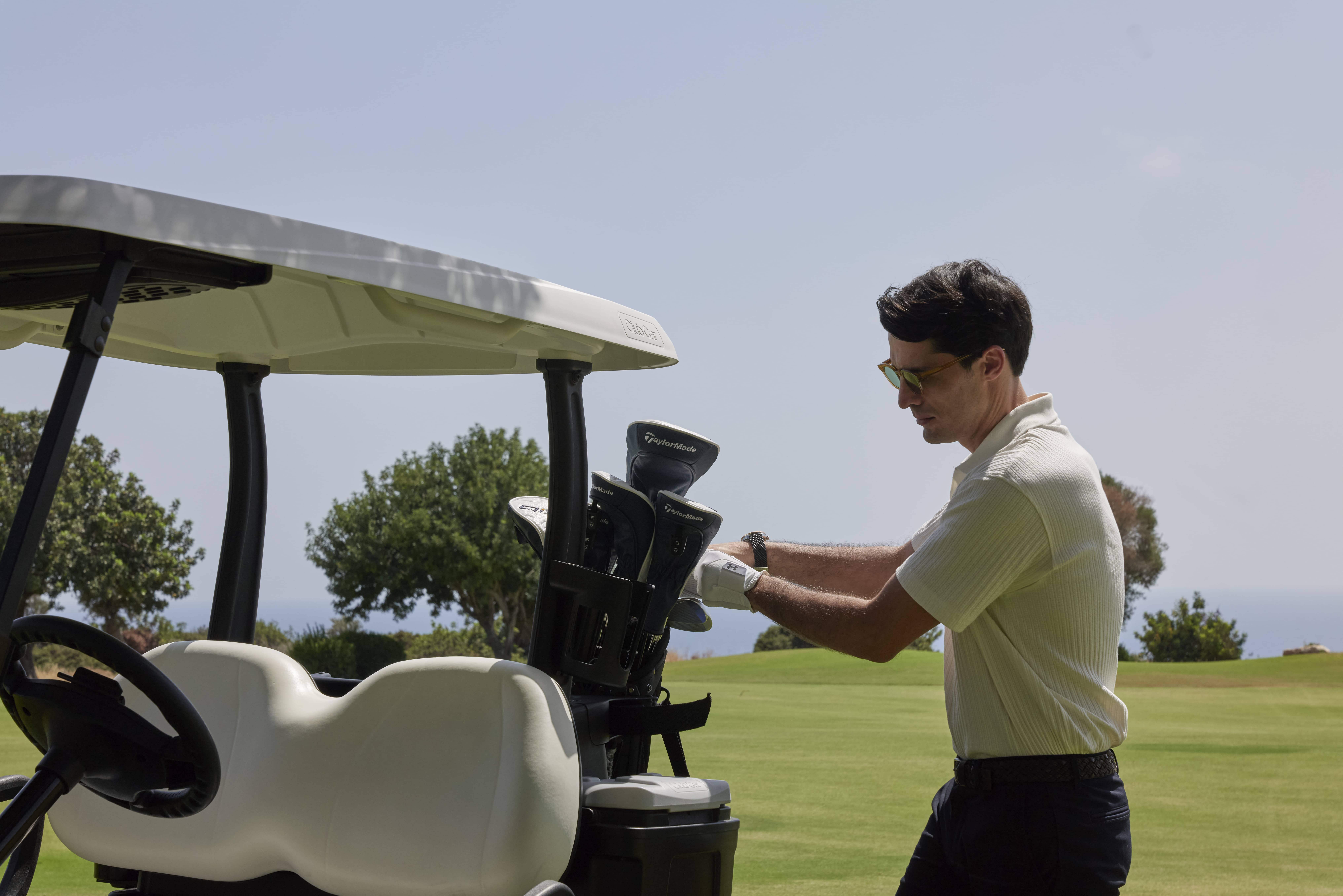 A man enjoying golf at the Aphrodite Hills Golf Course in Paphos, Cyprus.